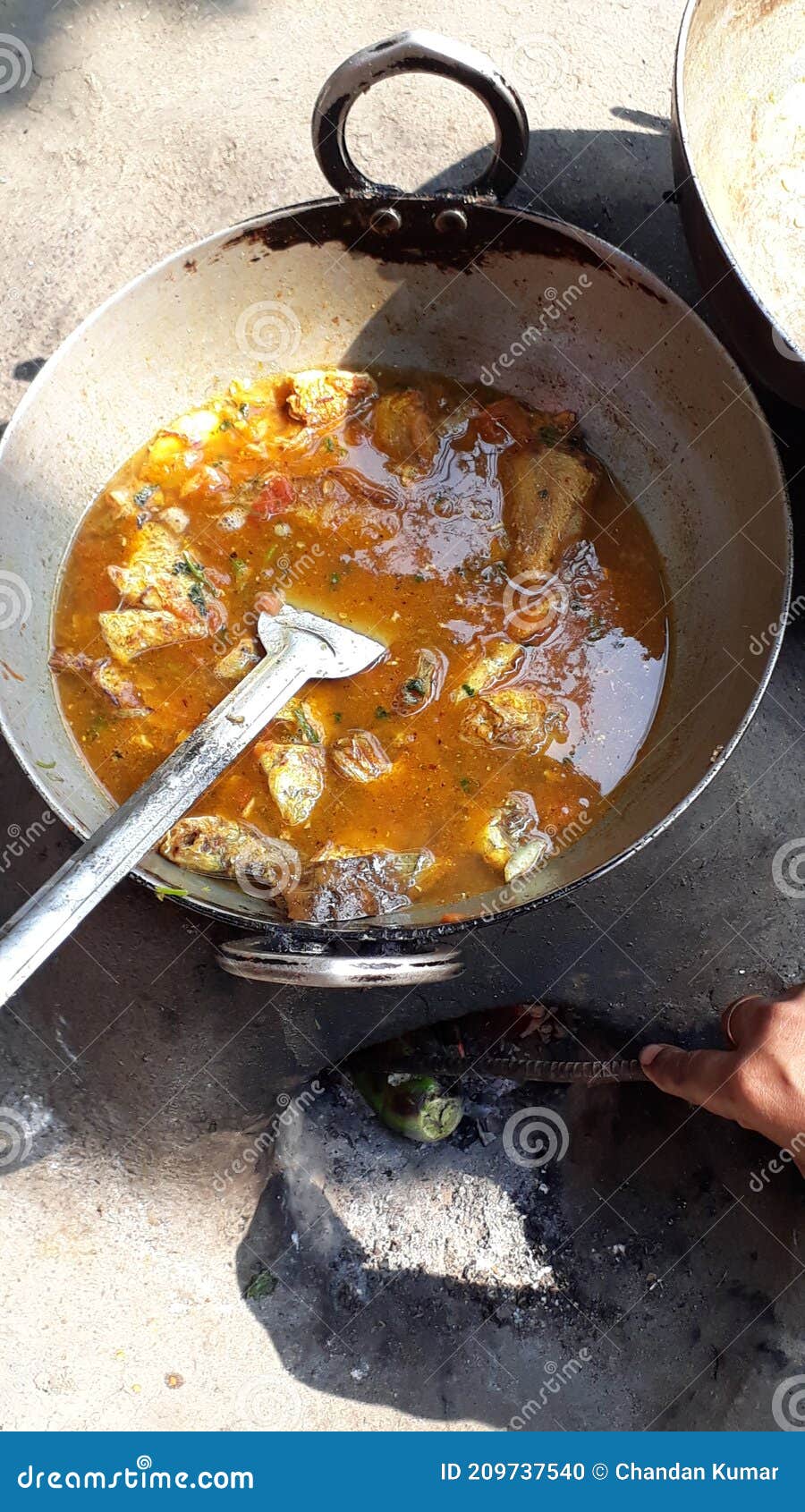 indian fish curry in outdoor cooking