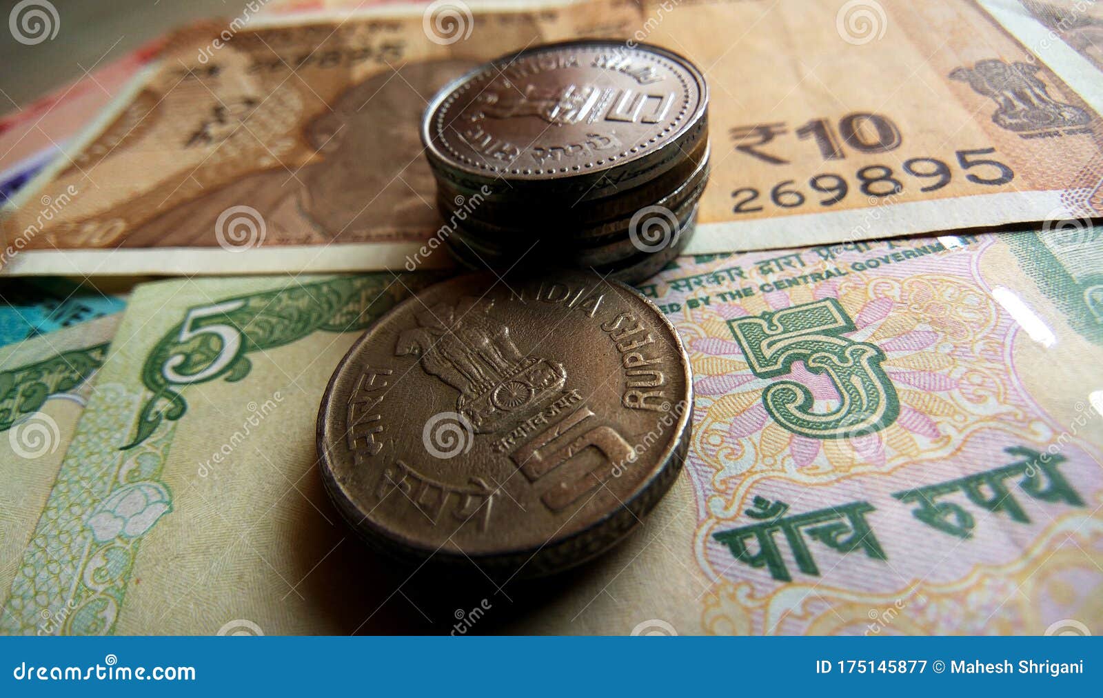 Indian Five Rupees Copper Coins & Notes, Five, Ten Notes are Background