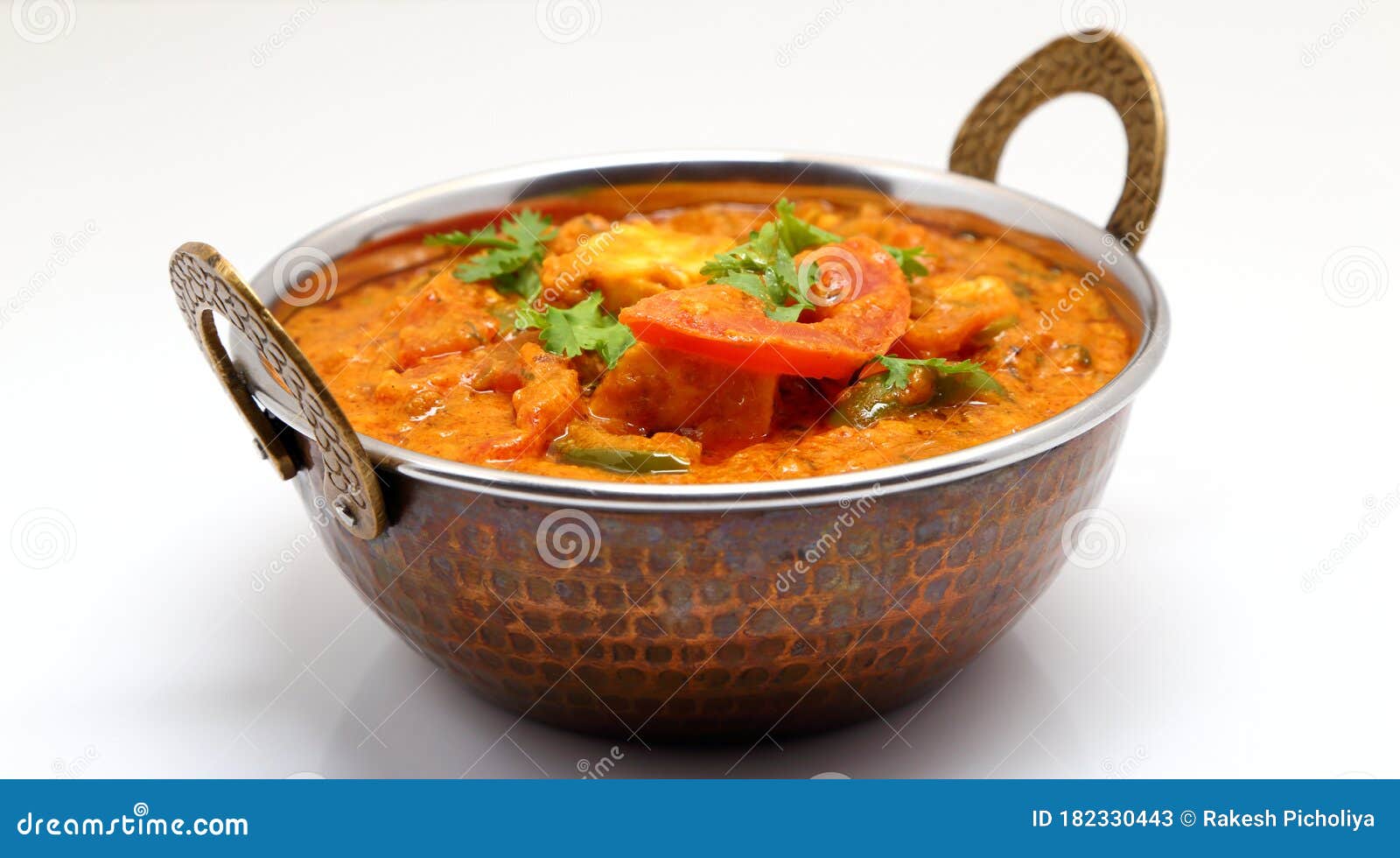 Indian Food or Indian Curry in a Copper Brass Serving Bowl Stock Image