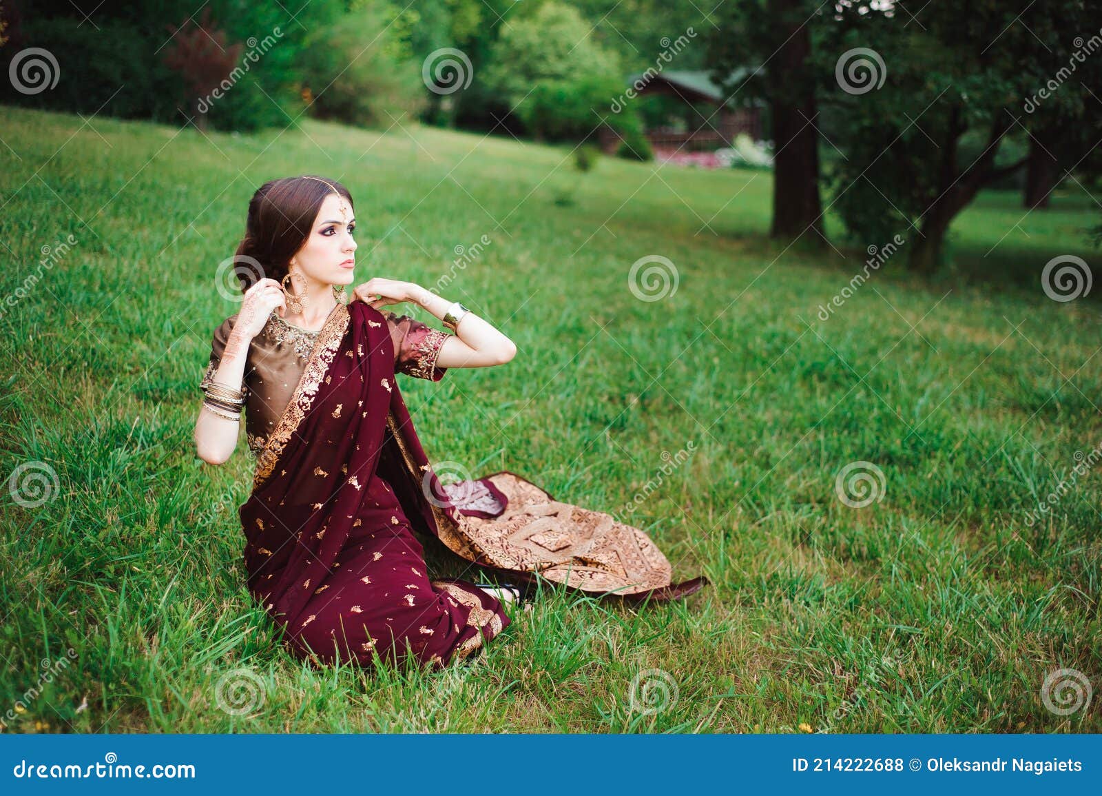 Indian Girl With Oriental Jewellery And Make Up Henna Applied To Hand Brunette Hindu Model Girl