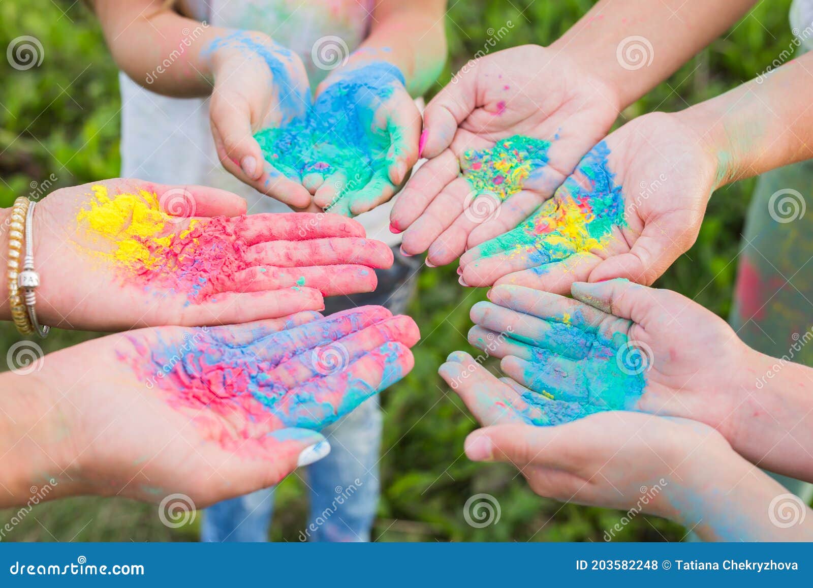 Indian Holidays, Fun and Holi Festival Concept Female Palms Covered