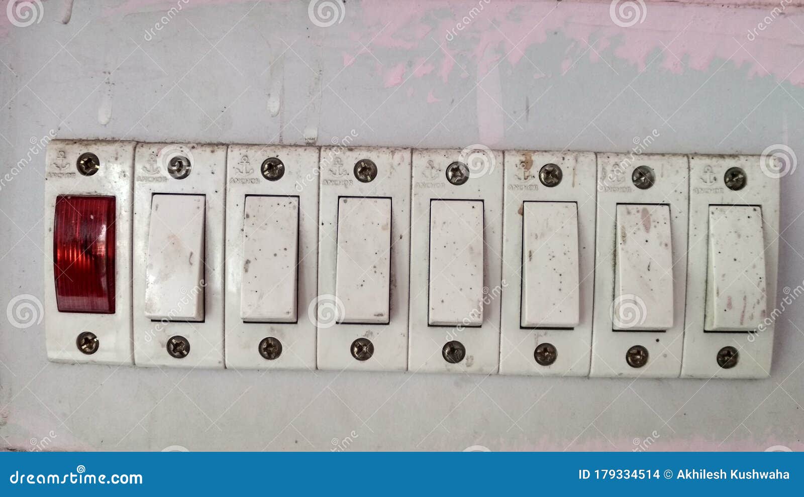 Indian Home Electric Switch Bord on the Wall. Kushinagar Stock Photo