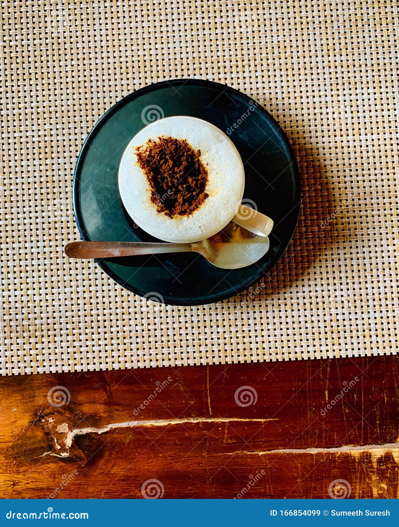 indian hot coffee with spoon and pot on a table