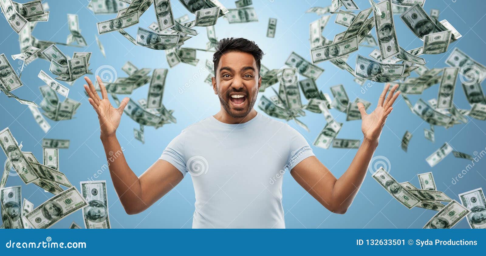 indian man celebrating triumph over money falling