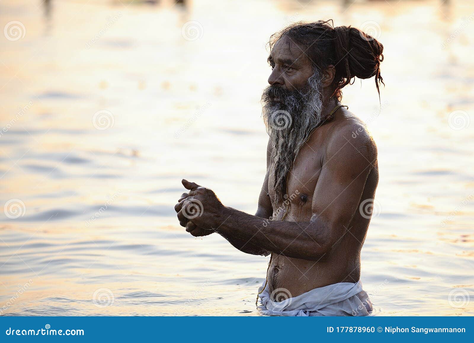Indian Man With A Mustache Without A Shirt On The Ganga River For
