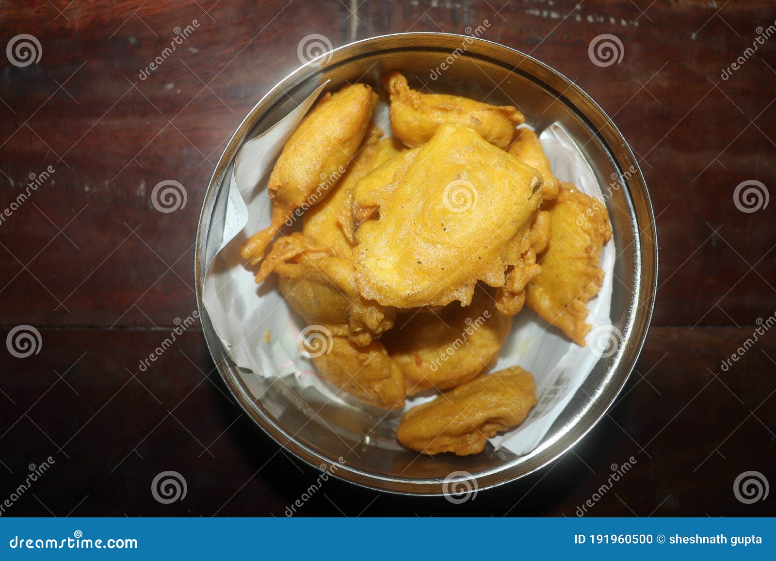 Indian Morning Breakfast on Wood Table in Camera Light. Stock Photo