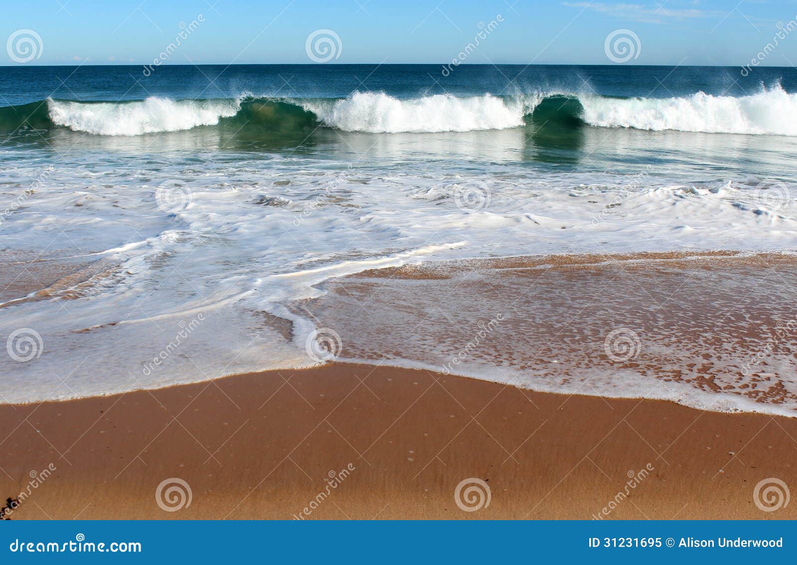 indian ocean waves rolling in at pristine binningup beach western australia on a sunny morning in late autumn.