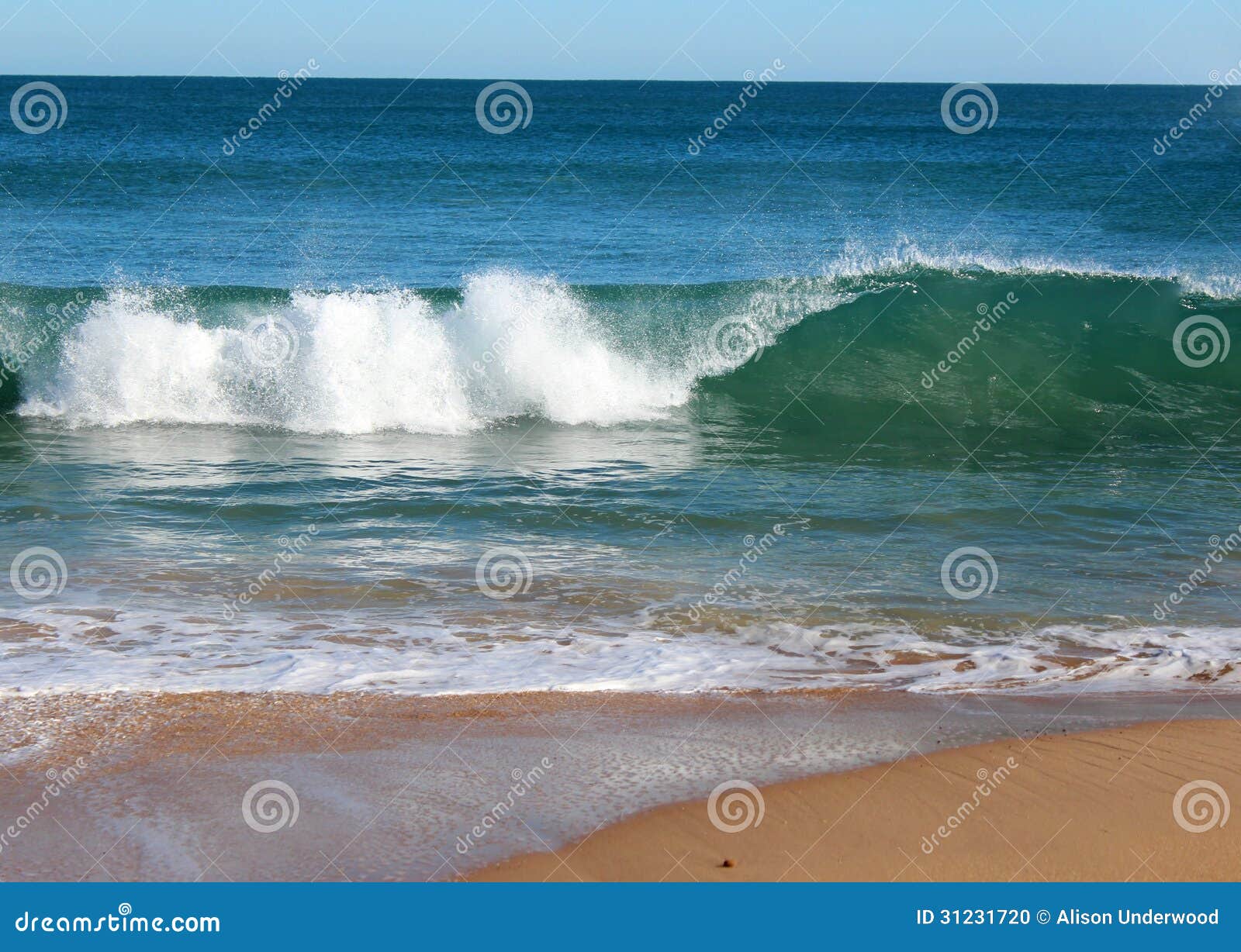 indian ocean waves rolling in at pristine binningup beach western australia on a sunny morning in late autumn.