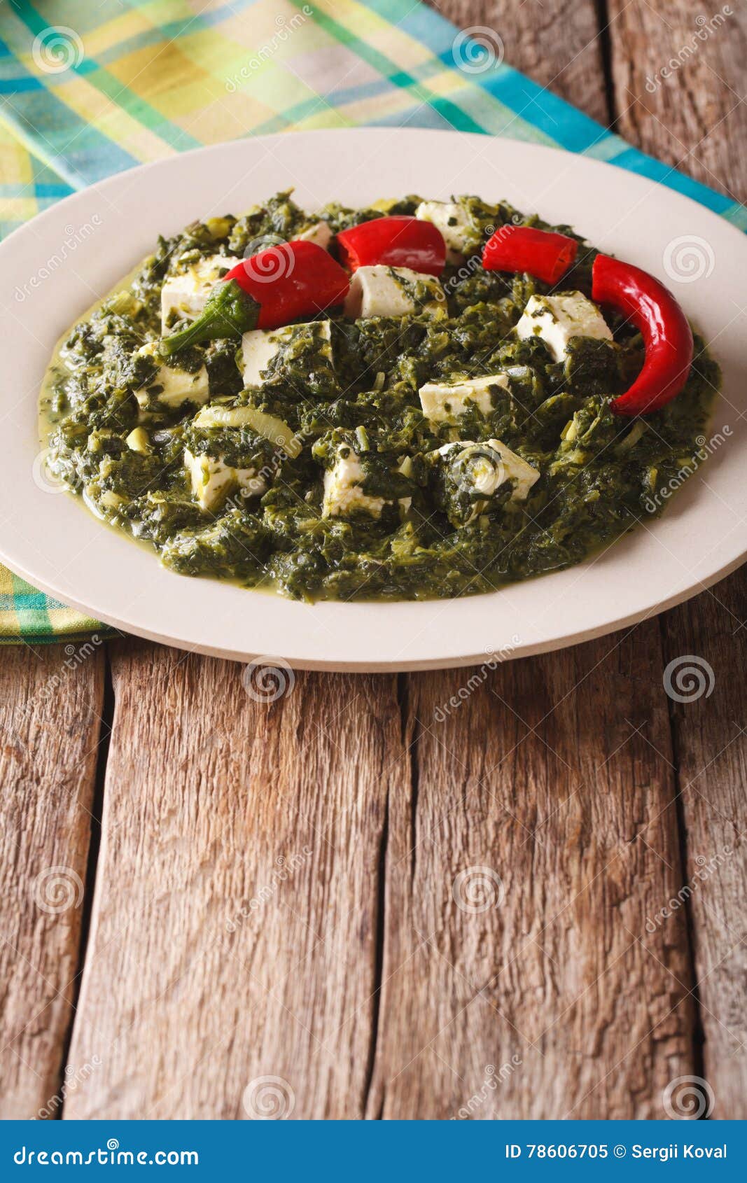 Indian Palak Paneer Spinach with Cheese and Spices Close-up. Vertical