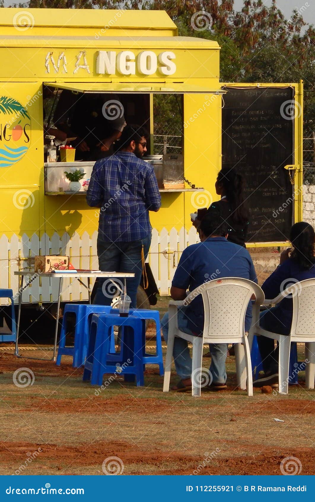 Indian People Buy Street Food at Food Trucks Stationed in Open Area