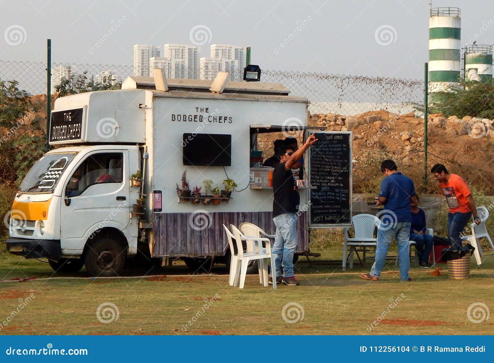 Indian People Buy Street Food at Food Trucks Stationed in Open Area
