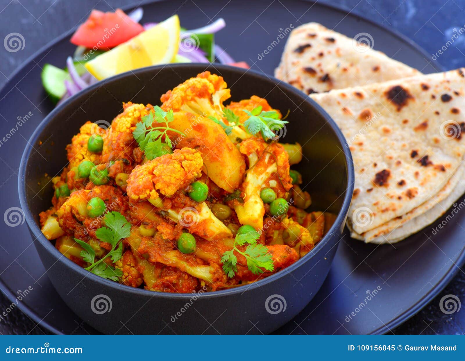 indian vegetarian meal-cauliflower curry with roti