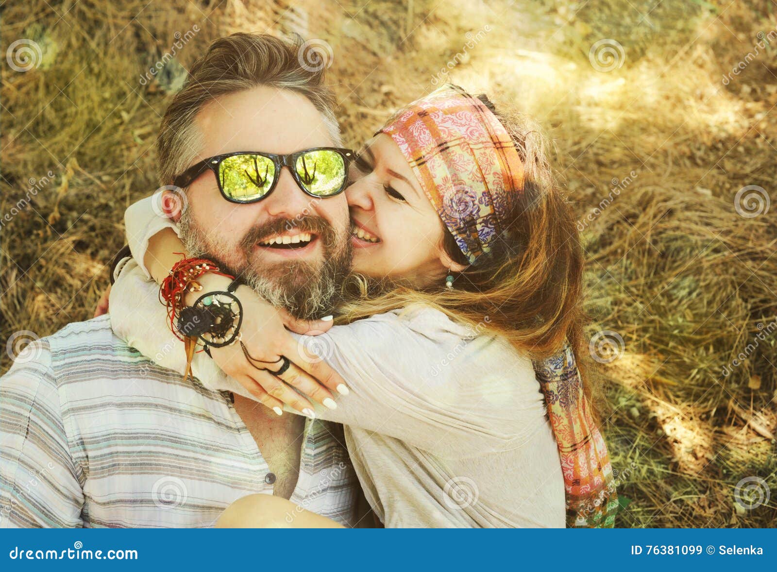 indie style smiling couple, woman embracing man, hipster outfit, boho chic