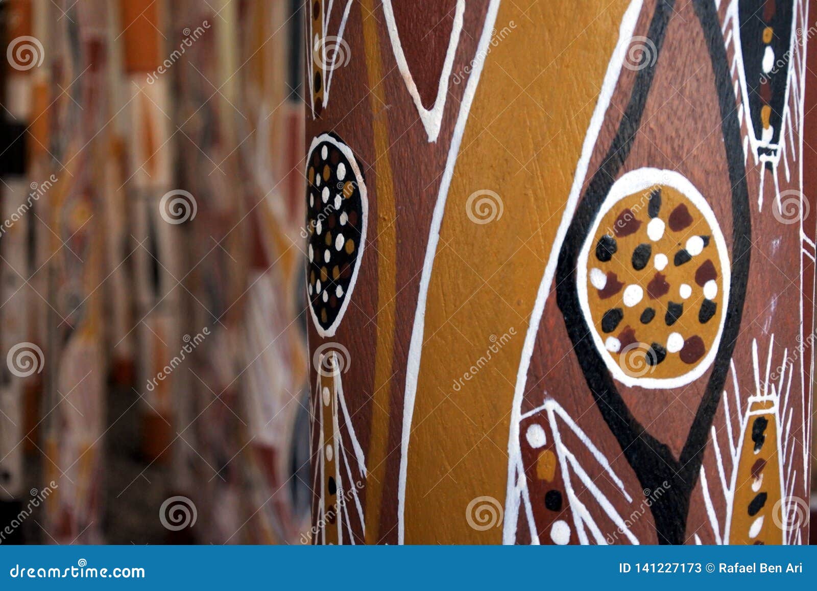 indigenous australian art dot painting on didgeridoo