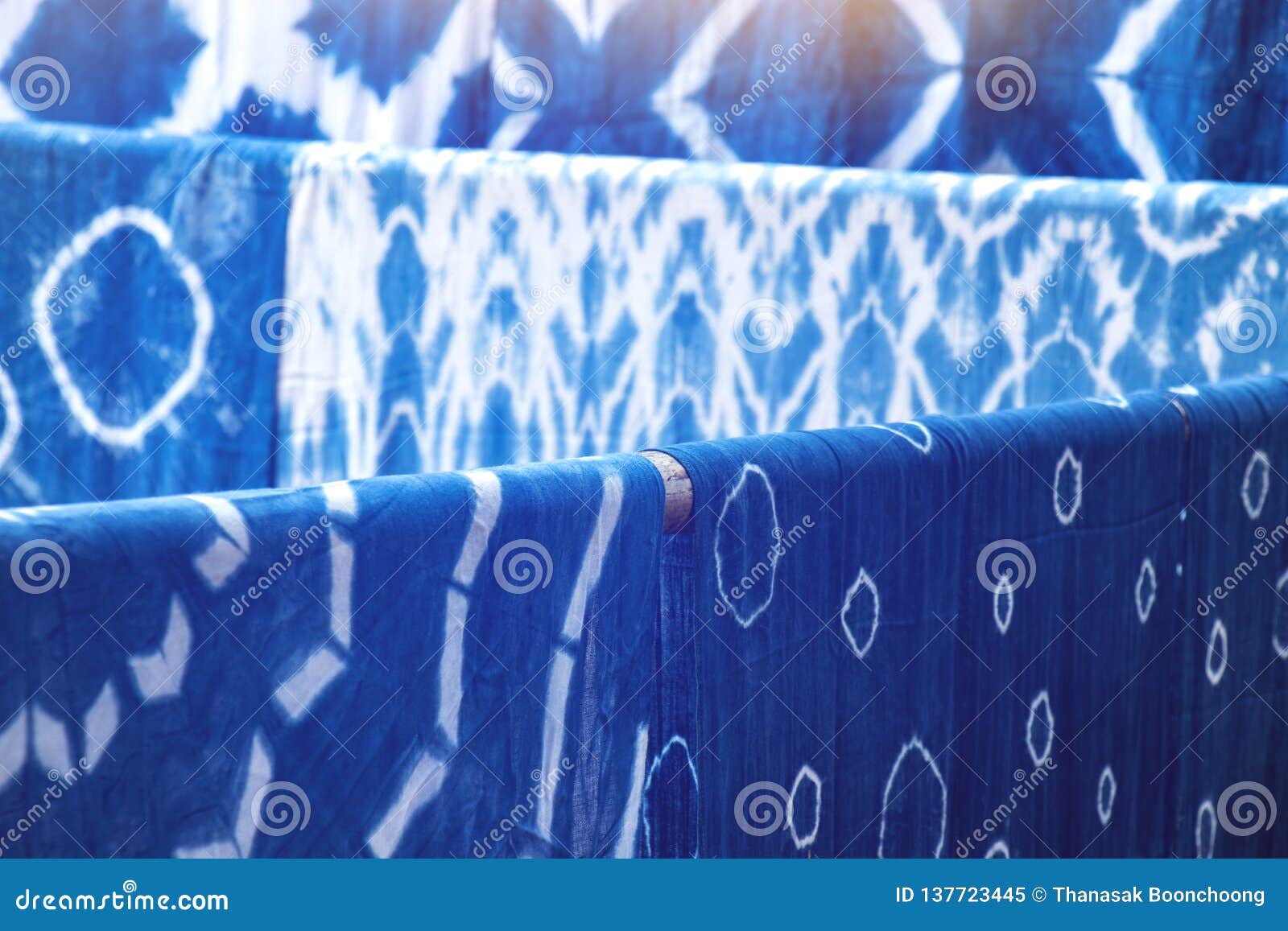 Indigo Dyed Fabrics, Dried at the Clothesline Background Stock Image