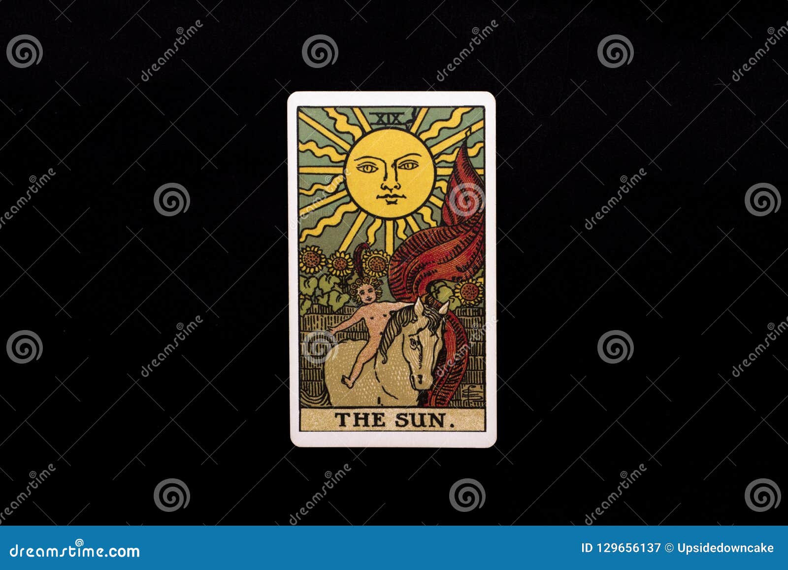 an individual major arcana tarot card  on black background. the sun.