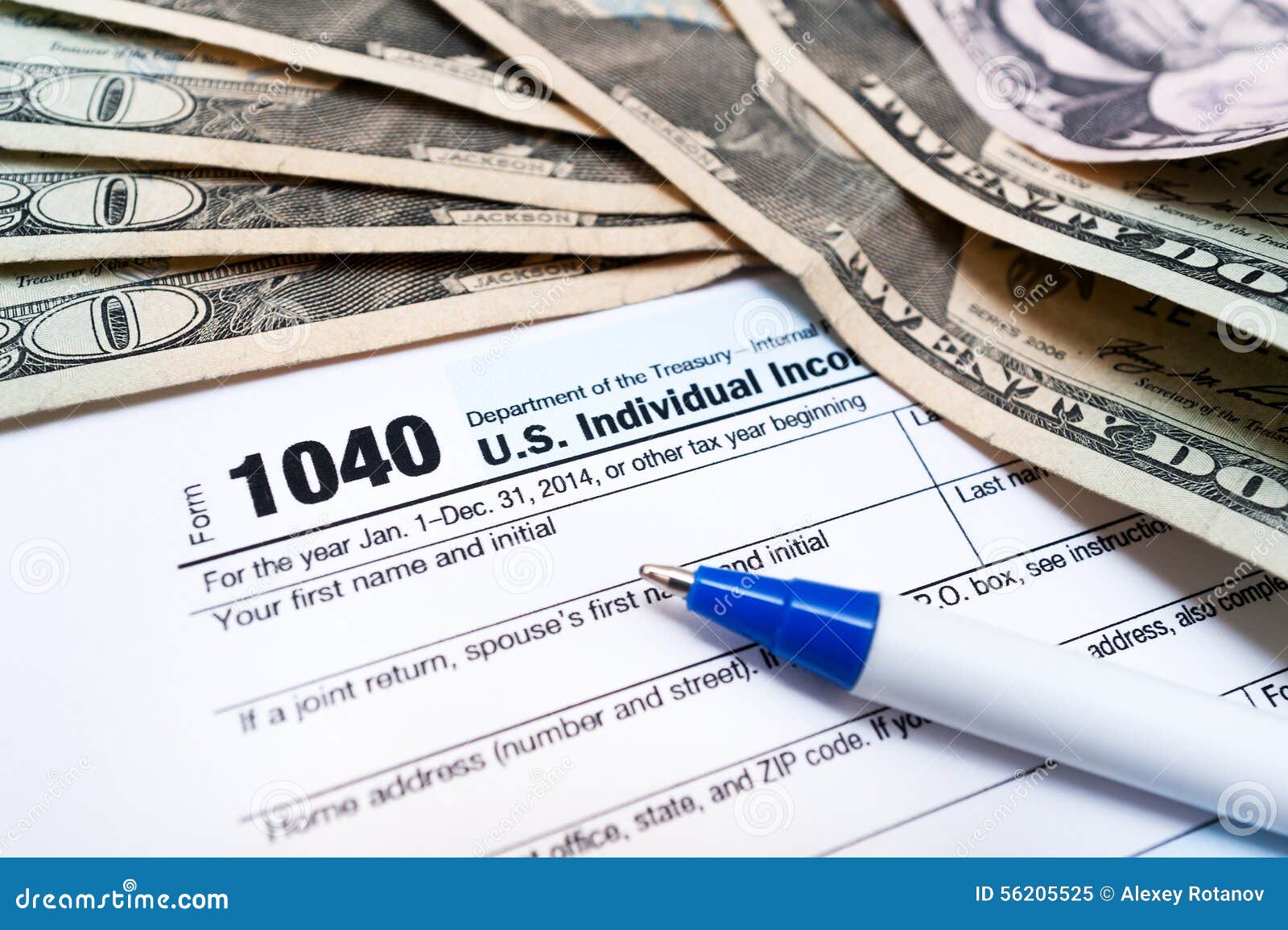 1040 Individual Tax Return Form With Pen And Dollar Money Bils Close Up Editorial ...