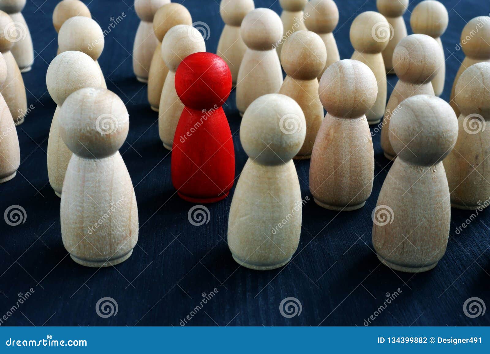 individuality, personality and originality concept. red wooden figure in crowd