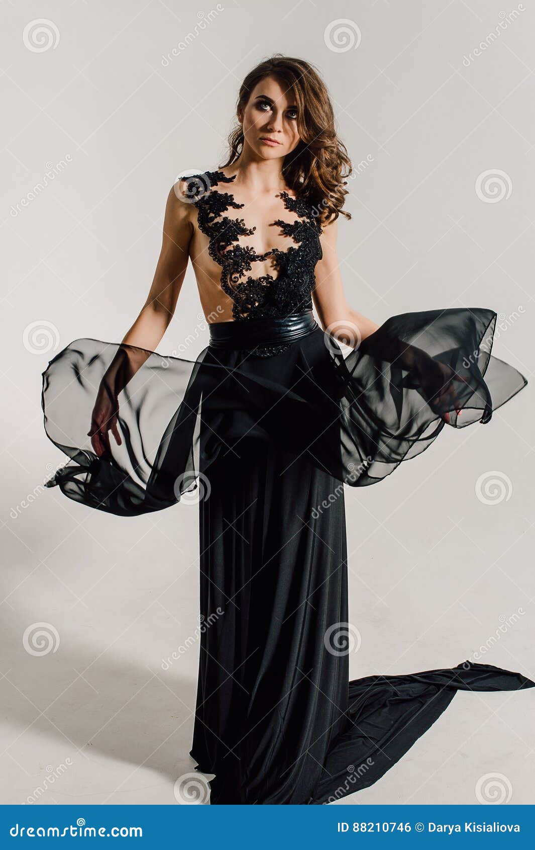 Individuality. Thoughtful Elegant Lady in Black Prom Evening Dress
