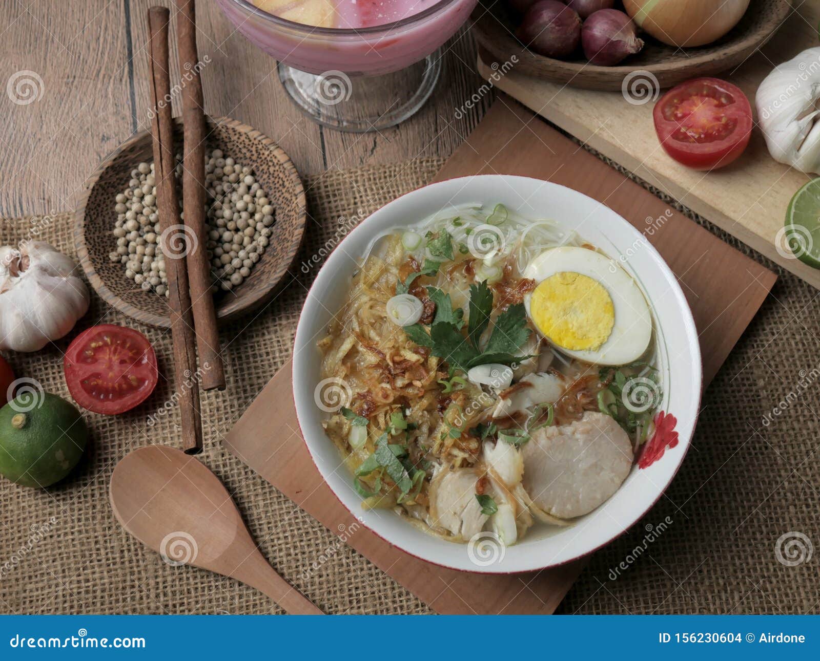 Indonesian Chicken Soto Or Soto Ayam, Served With Ketupat