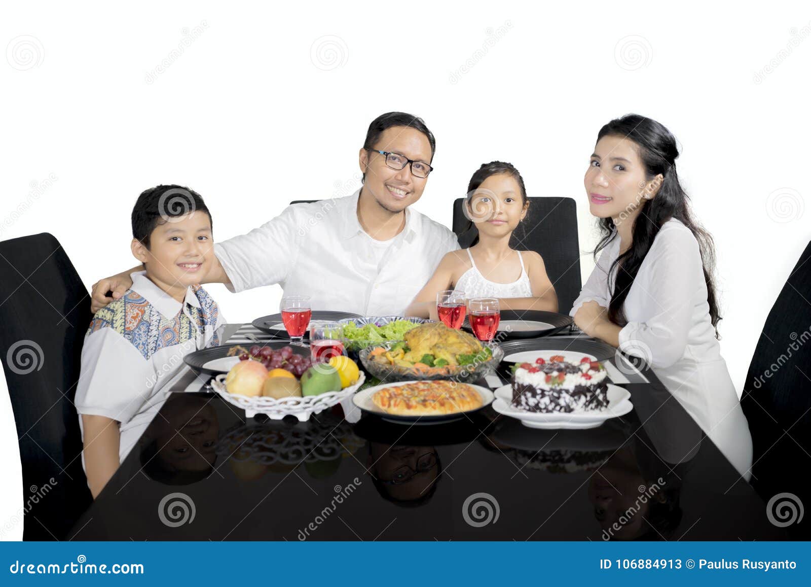 Indonesian Family Having a Dinner on Studio Stock Image - Image of