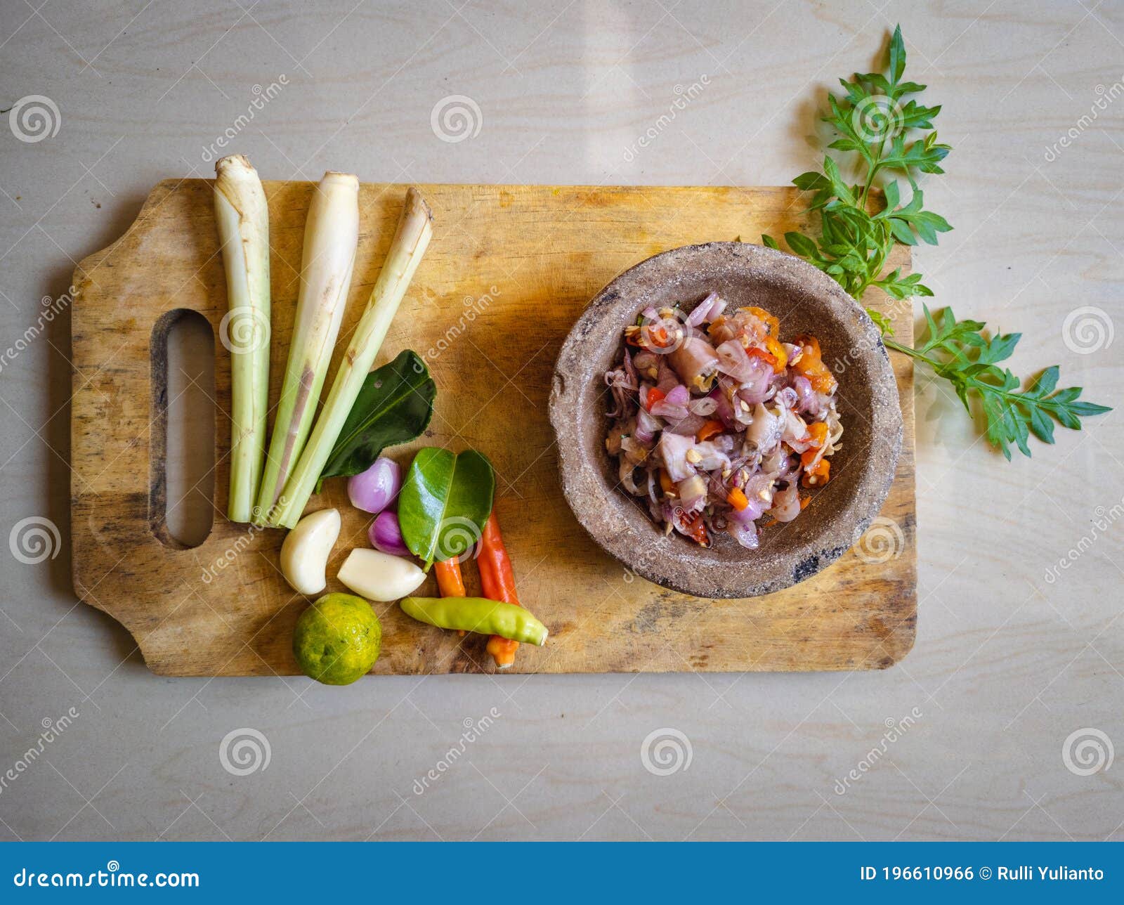 indonesian food squid with raw fresh sauce. cumi sambal matah