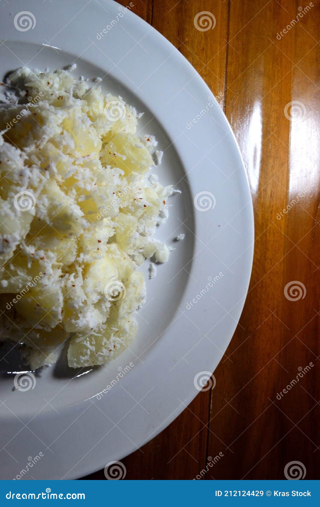 boiled cassava wrapped in grated coconut