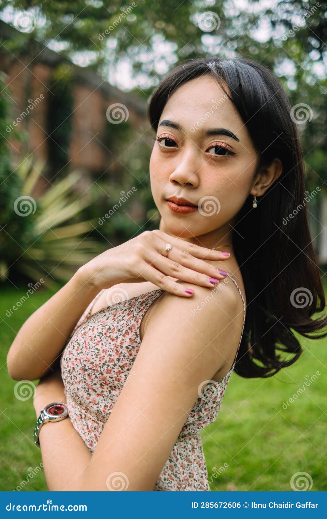 An Indonesian Woman with Long Black Hair Standing Very Gracefully Stock ...