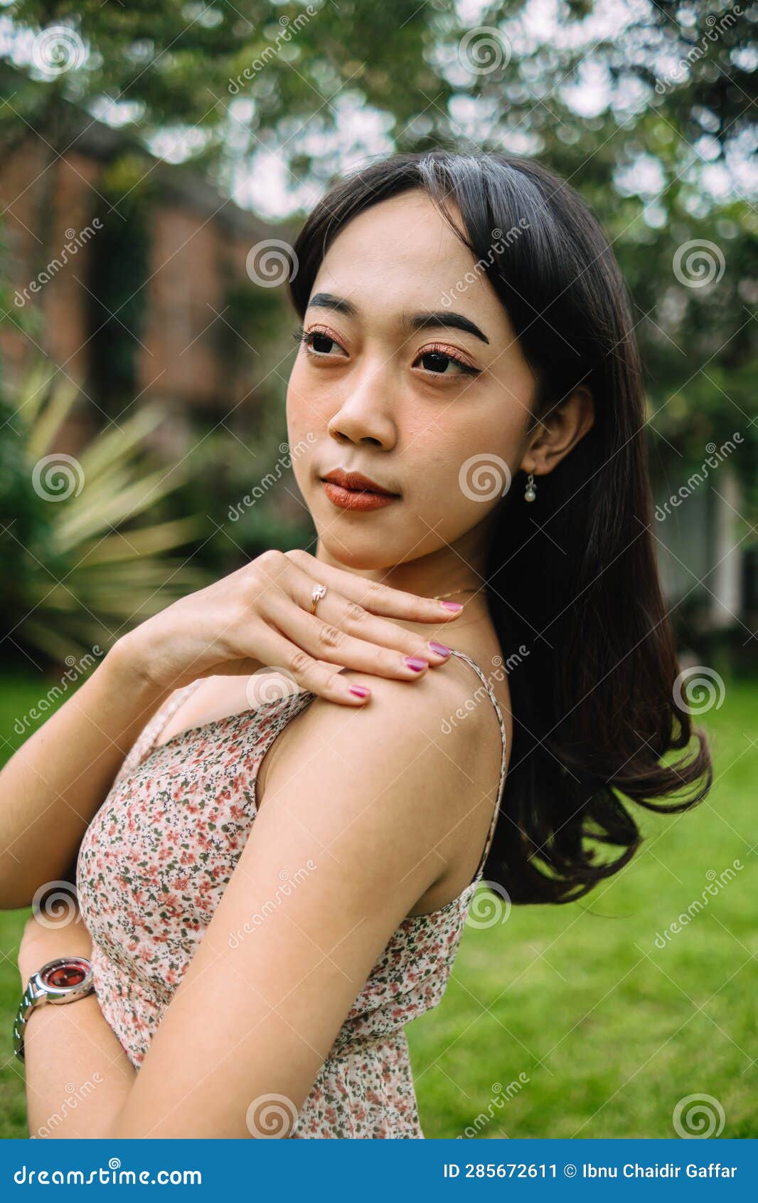 An Indonesian Woman with Long Black Hair Standing Very Gracefully Stock ...