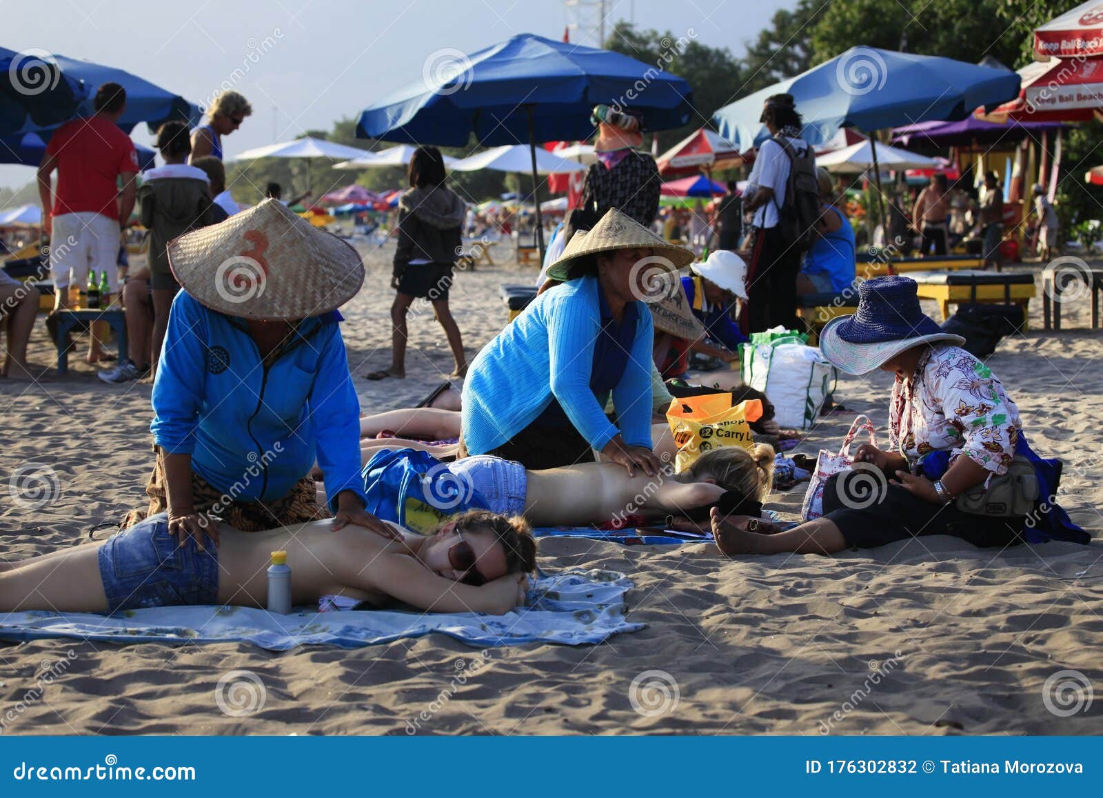 Indonesian Women Massage Girls To Tourists On The Beach On