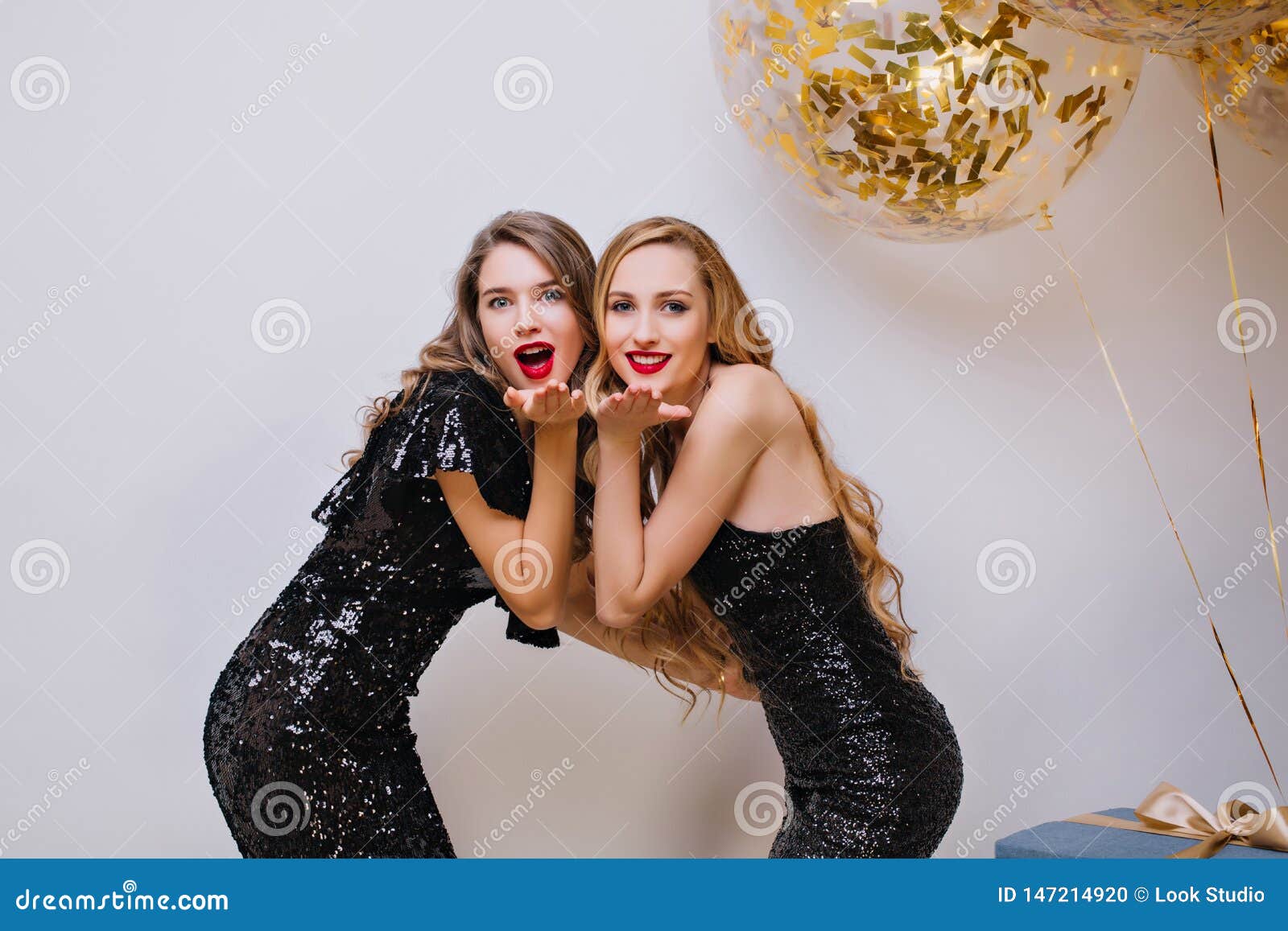 Indoor Photo of Refined Girls with Bright Make-up Posing Together on ...