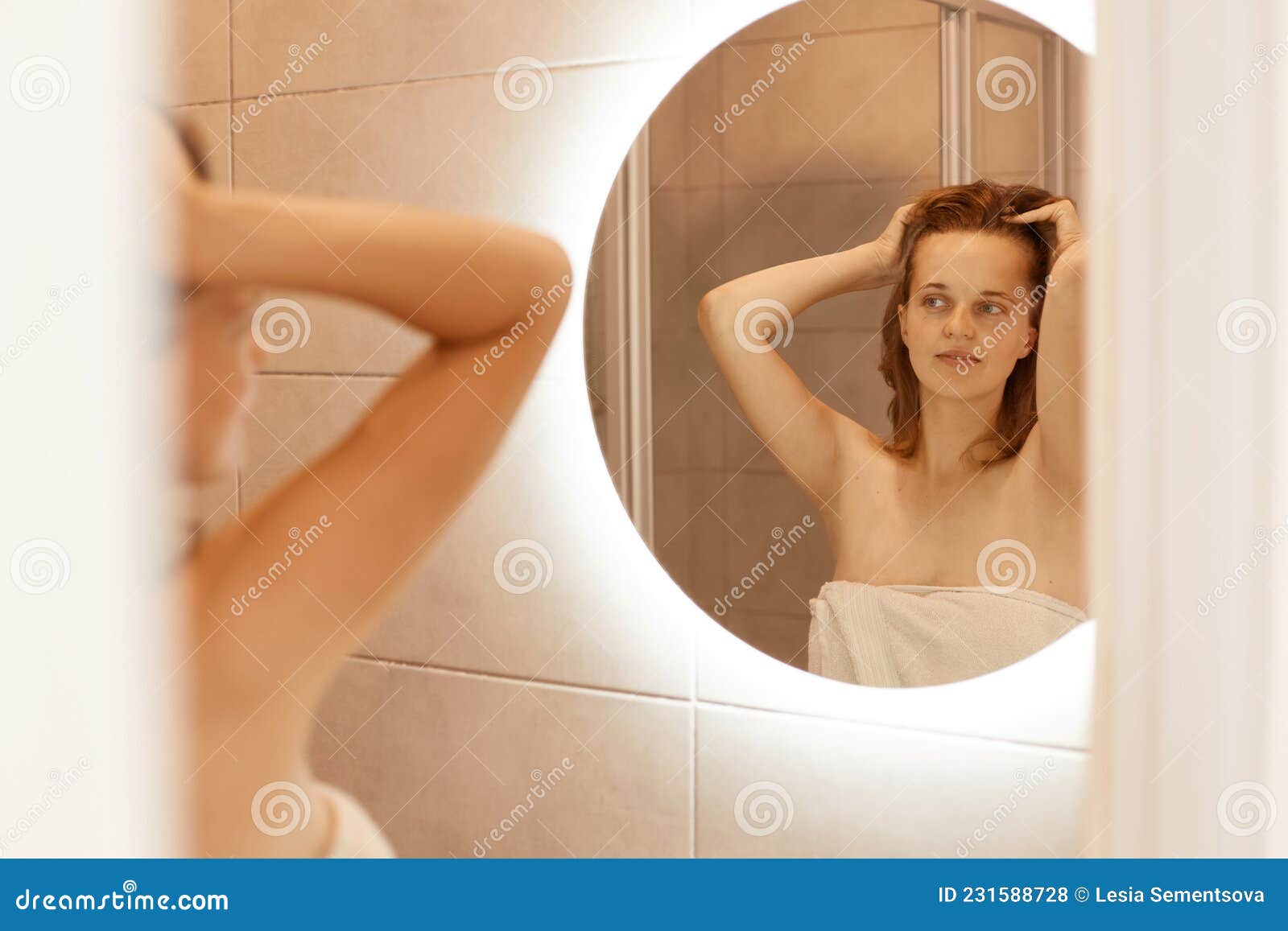 Cute blond playing with herself in the bath