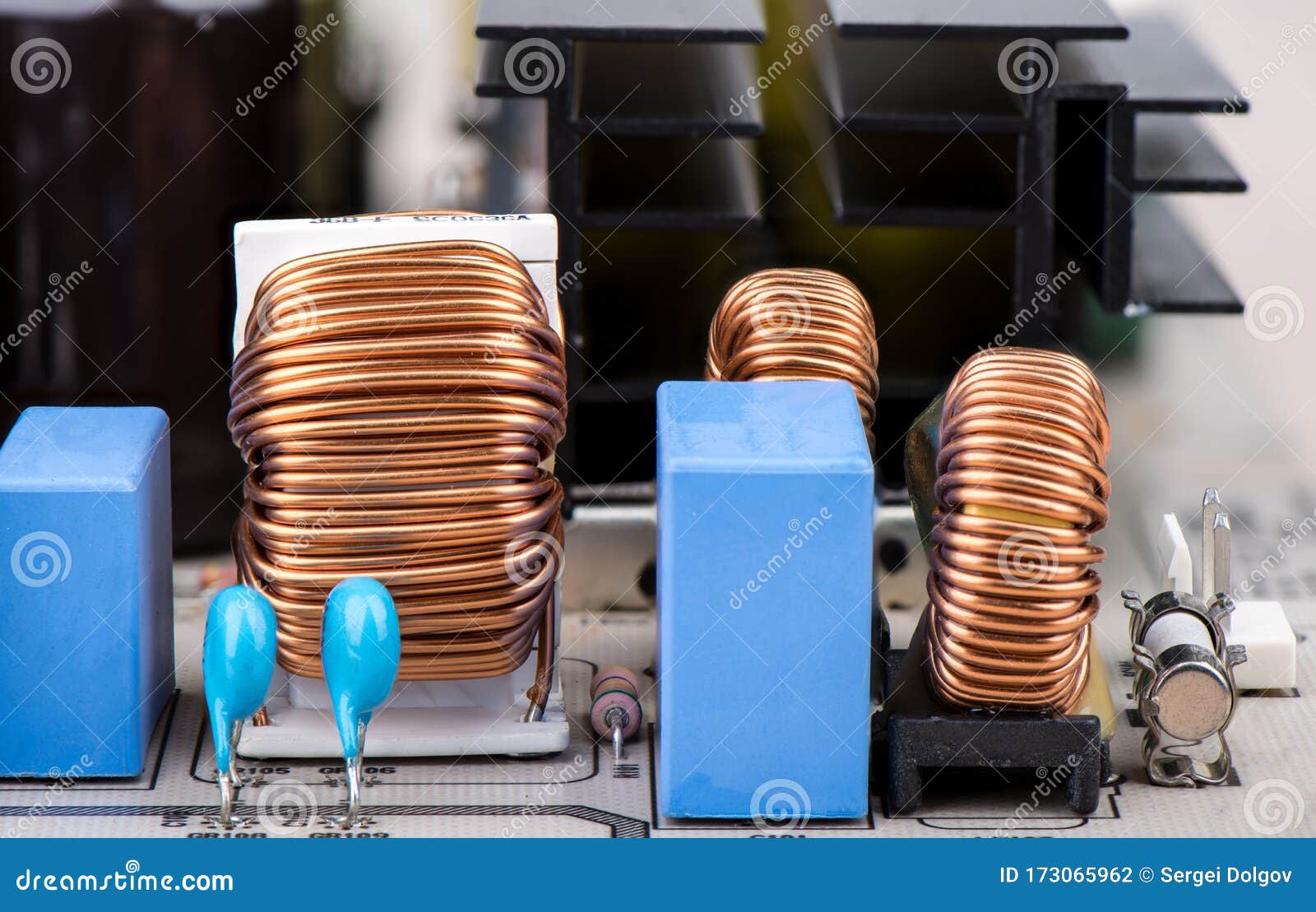 Inductors, Resistors with Capacitors and Fuse Closeup. Stock Photo