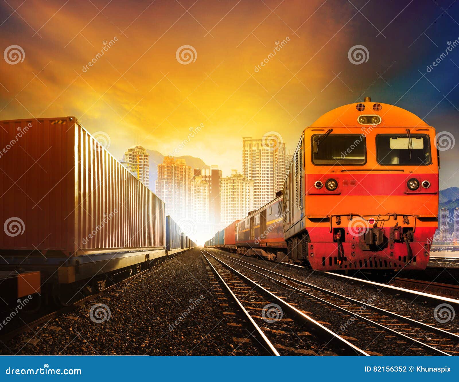 industindustries container trainst and boxcar on track against b
