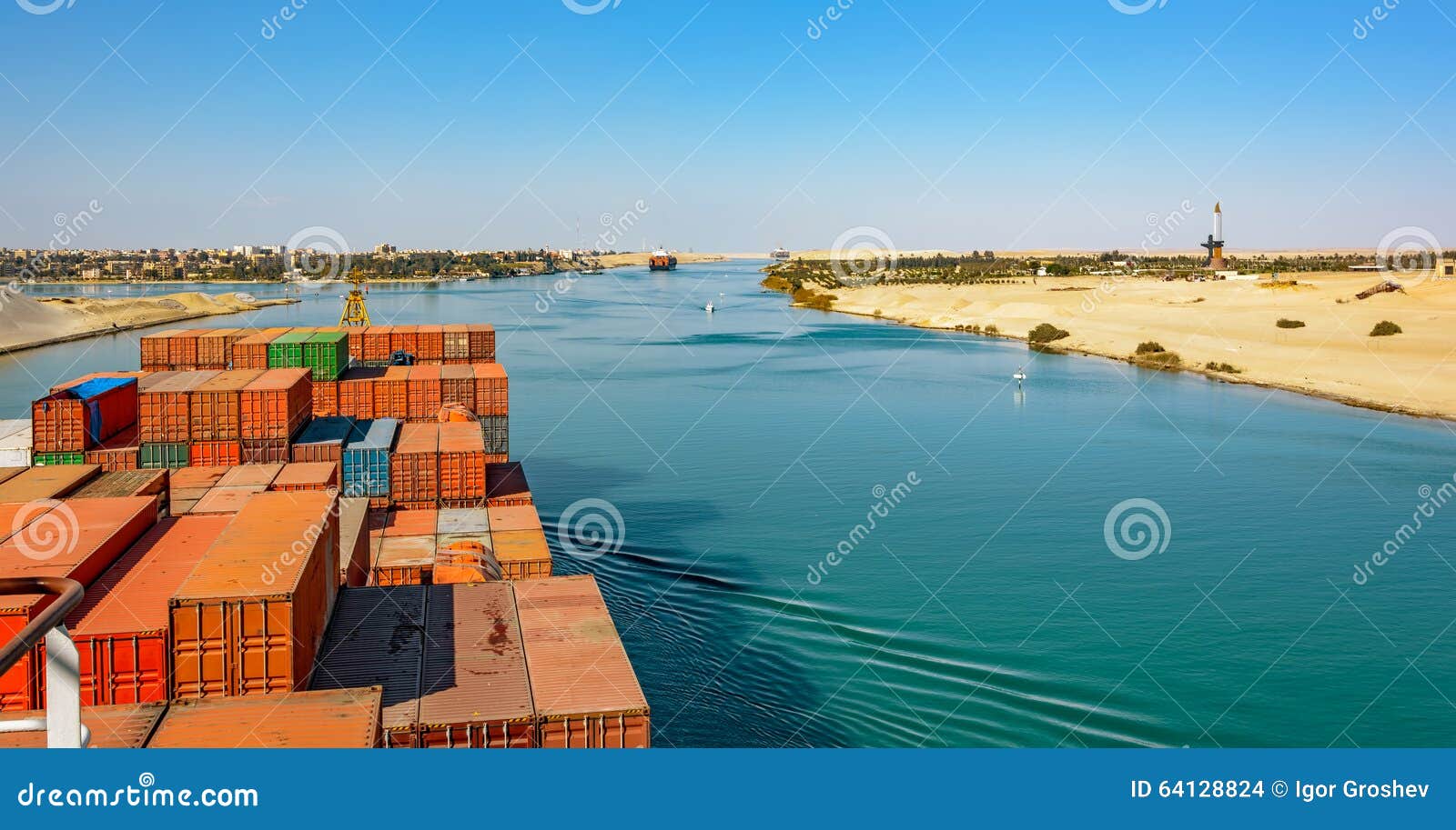 industrial container ship passing through suez canal with ship's