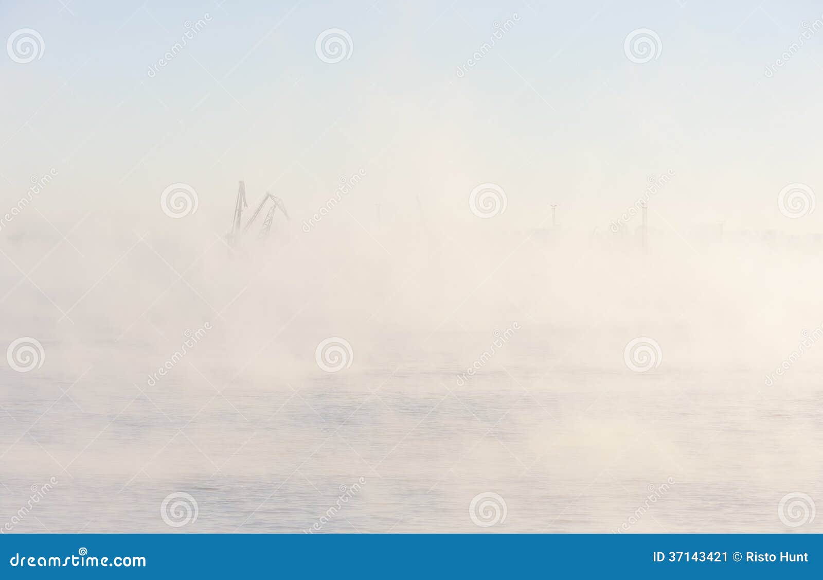 industrial crane in mist