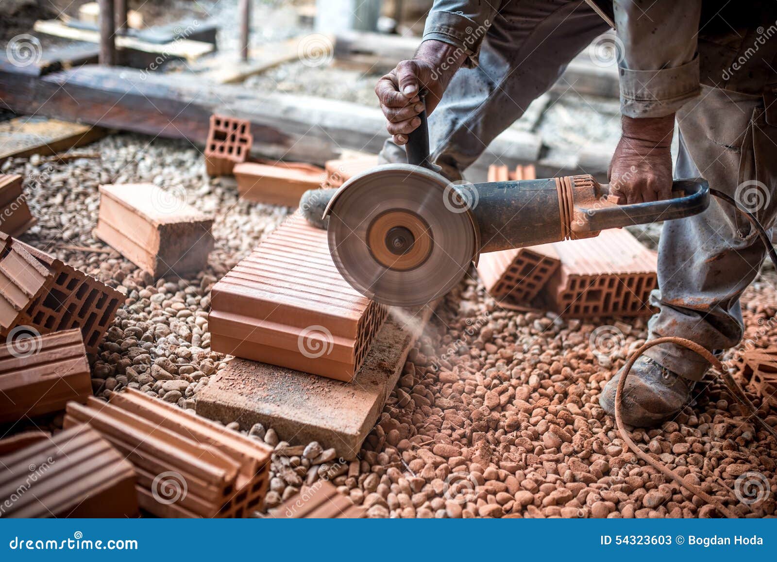 Industrial Engineer Working on Cutting Bricks at Construction Site
