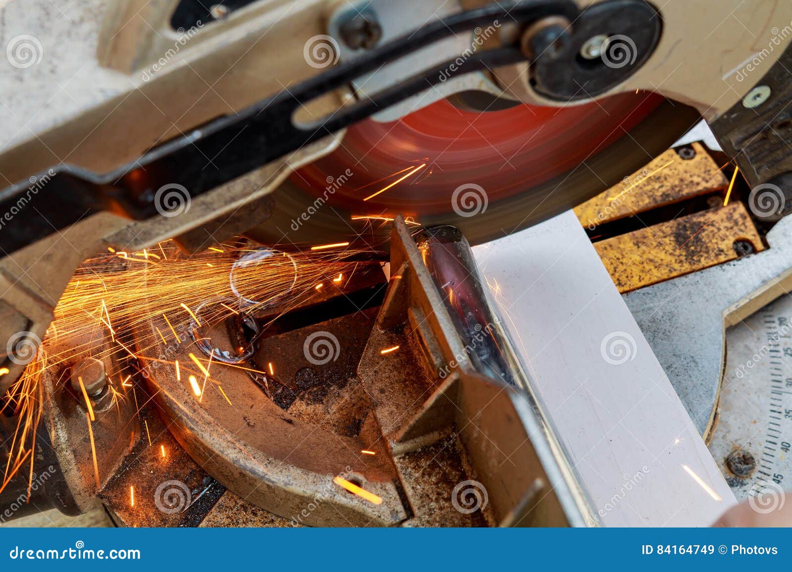 Industrial Engineer Working on Cutting a Metal and Steel with Compound