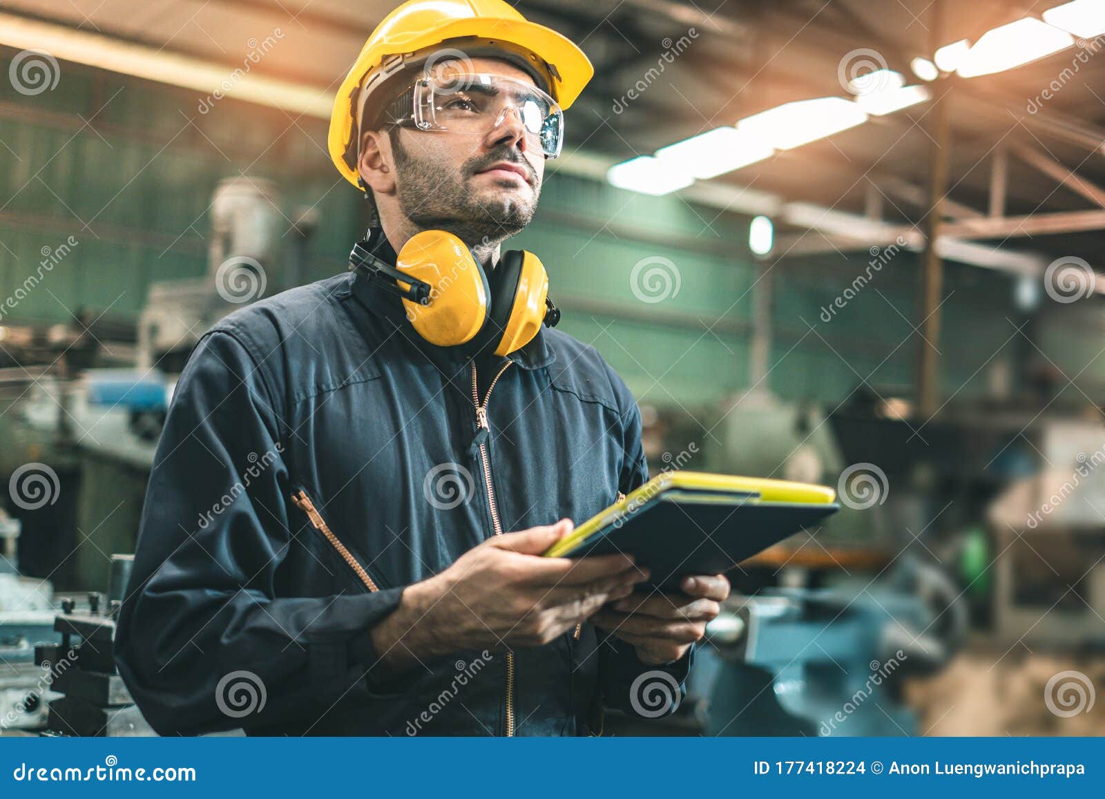 industrial engineers in hard hats.work at the heavy industry manufacturing factory.industrial worker indoors in factory. man