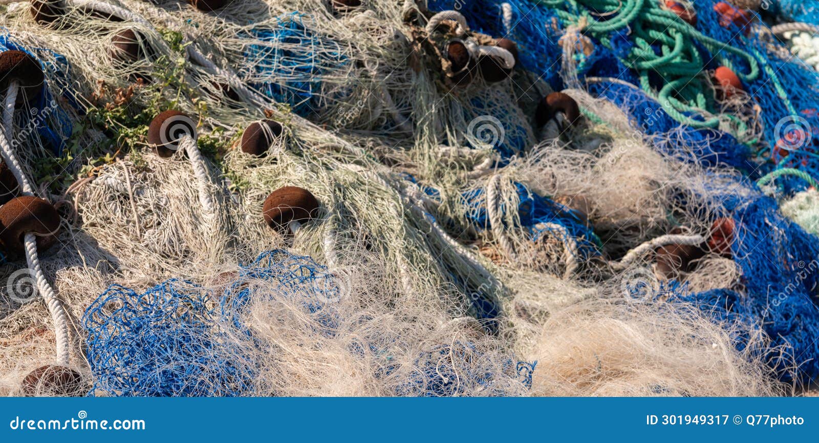 Industrial Fishing Equipment Fishnets and Fishing Lines Lying on Concrete  in the Port Stock Image - Image of line, harbor: 301949317
