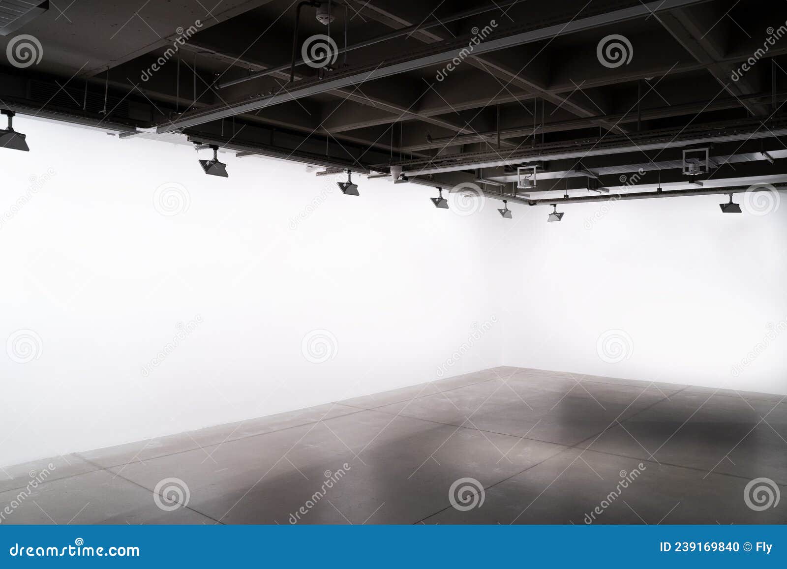 Industrial Interior with Lights and Empty White Walls Stock Photo