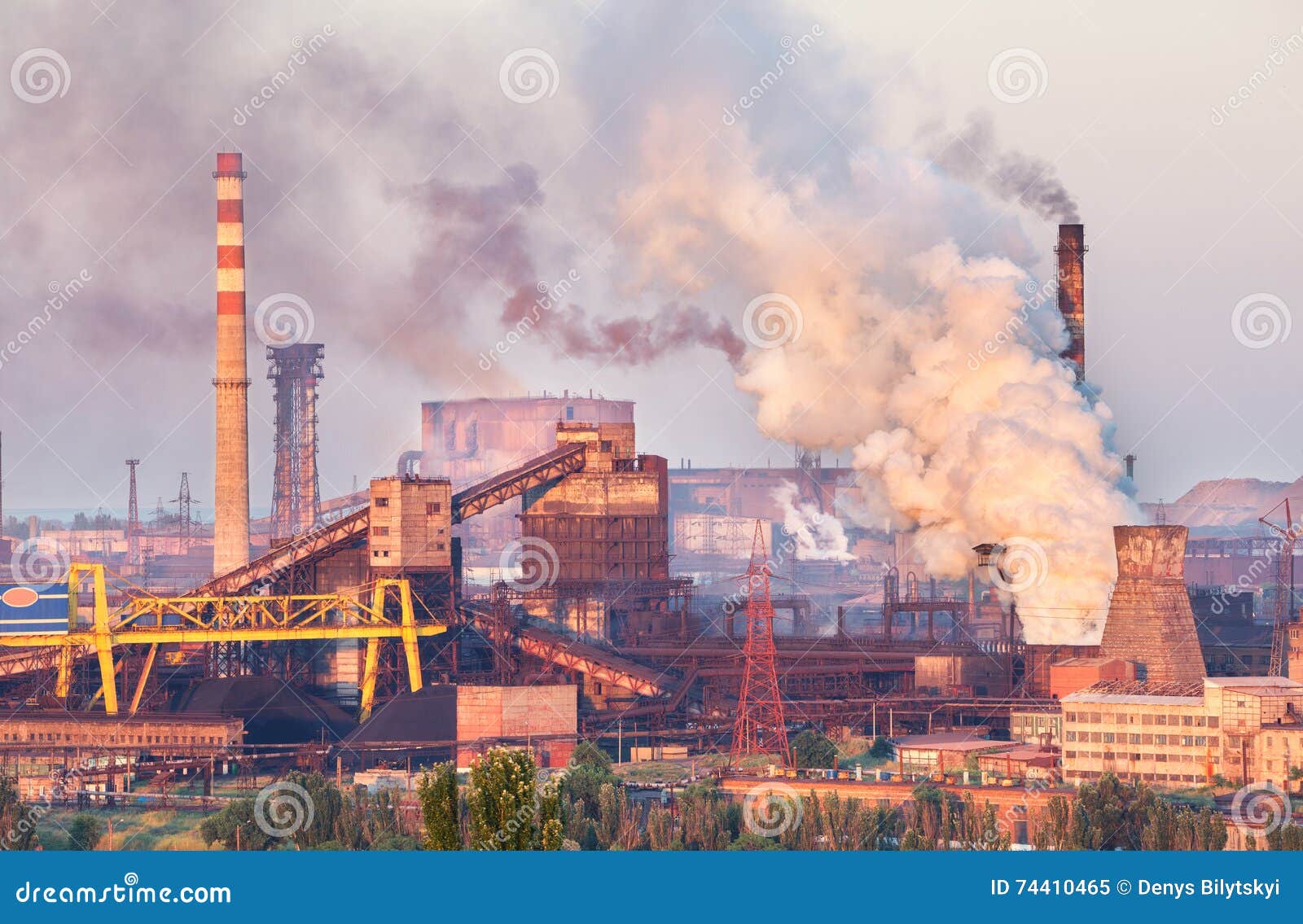 industrial landscape in ukraine. steel factory at sunset. pipes with smoke. metallurgical plant. steelworks, iron works