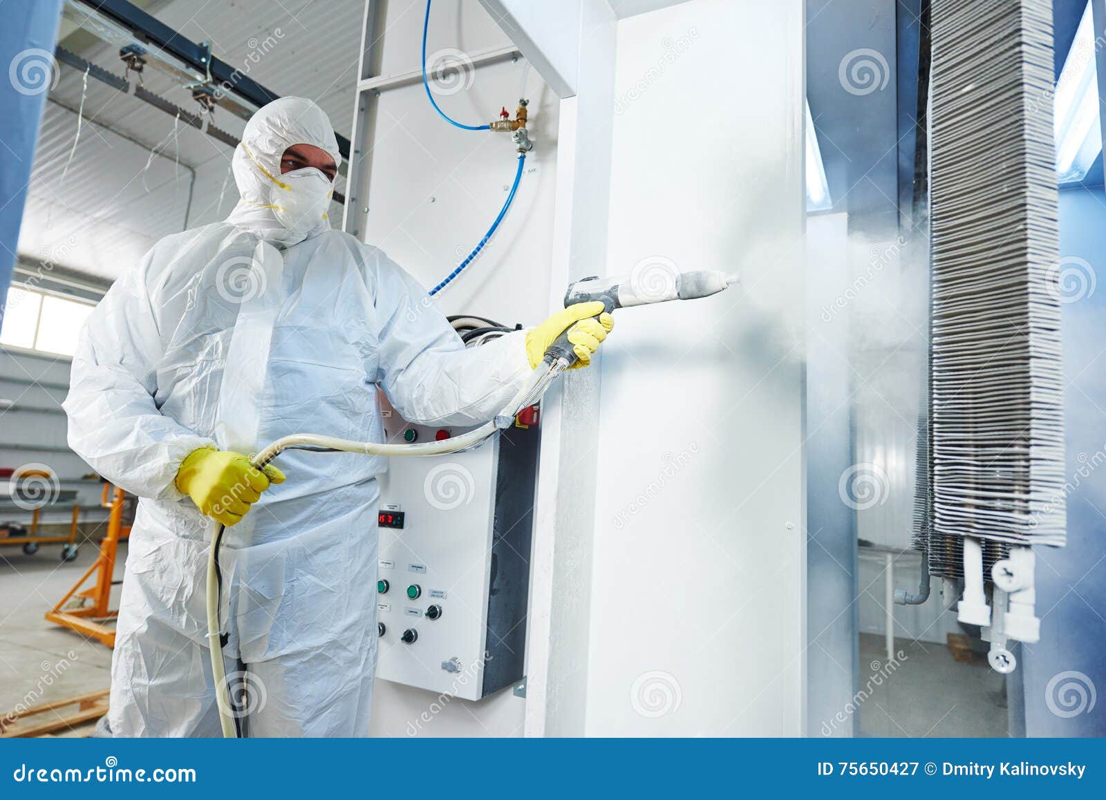 industrial metal coating. man in protective suit, wearing a gas