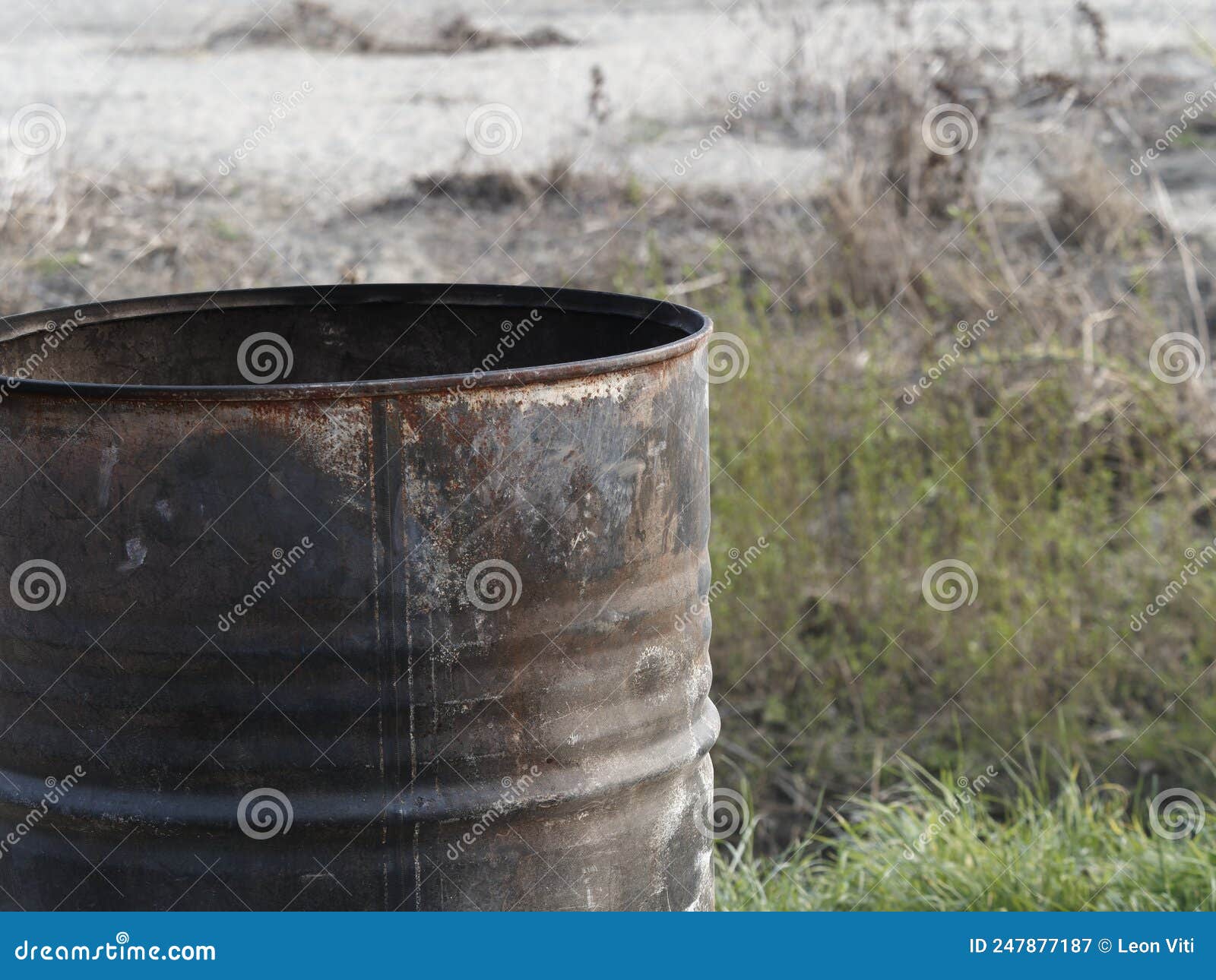 industrial rusty metal barrel, environmental pollution, corrosion