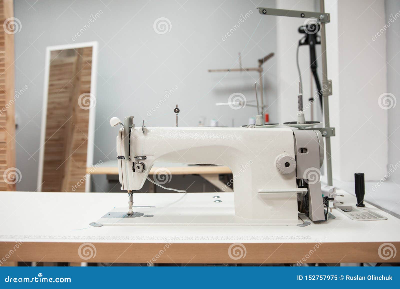 Industrial Sewing Machine Sews A bing Sling. Manufacture Of Textile