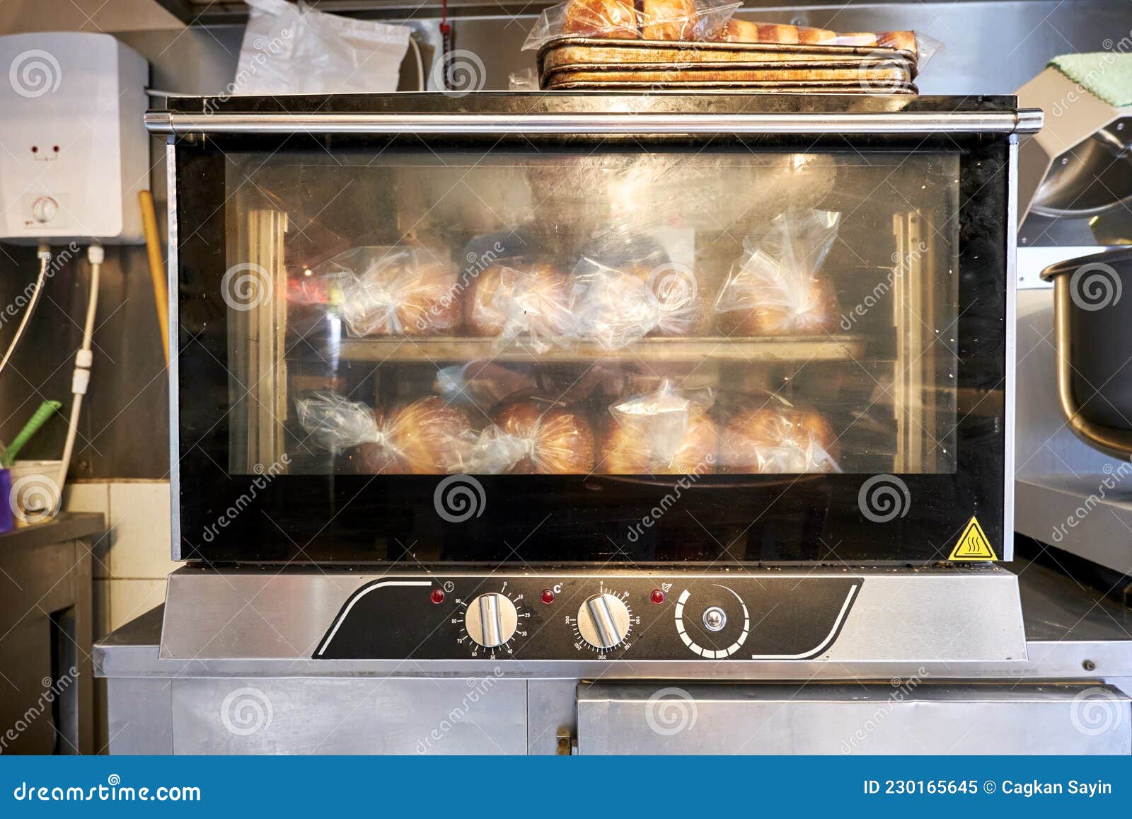 Industrial Small Size Bread Oven with Cooked Breads in a Restaurant