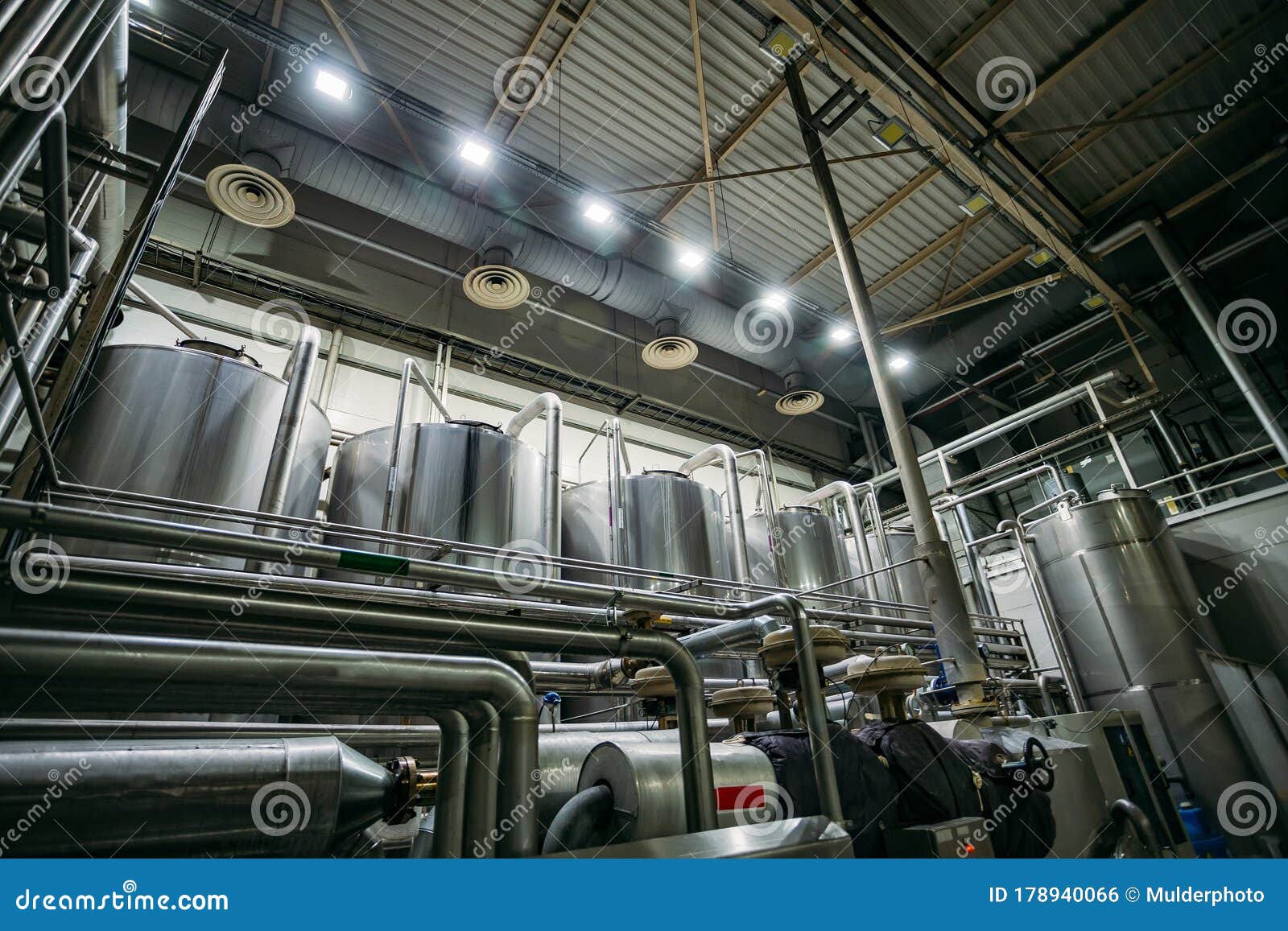Industrial Stainless Steel Fermentation Vats in Modern Brewery Stock