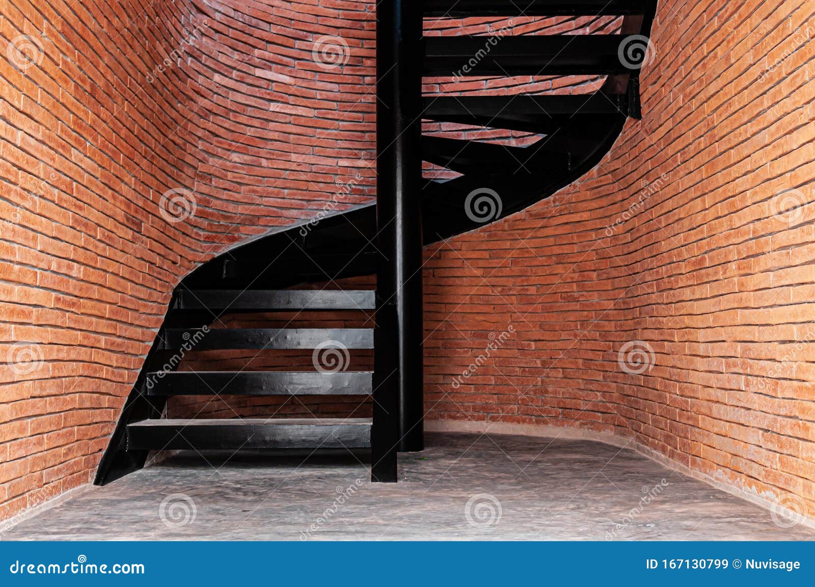 Industrial Style Spiral Staircase with Red Brick Wall and Concrete ...