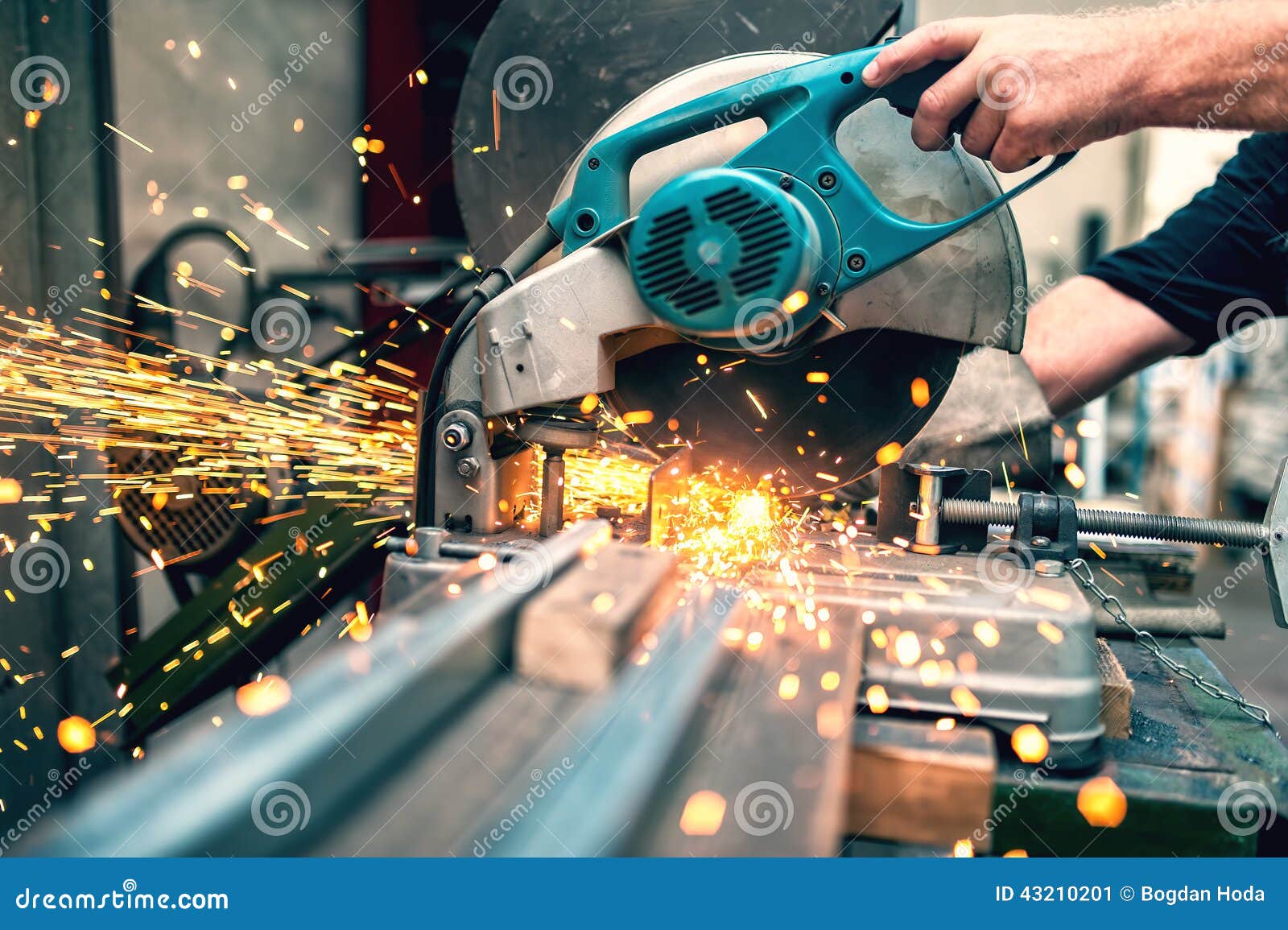 Industrial Worker Using a Compound Mitre Saw with Sharp Blade Stock