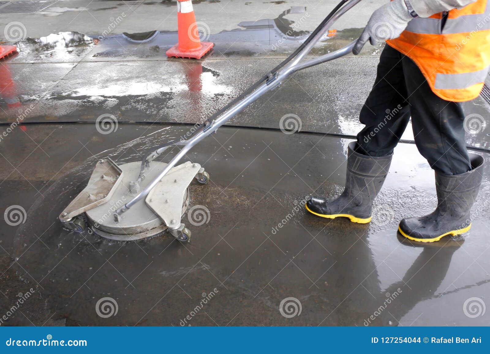 Industrial Worker Using a Surface Cleaner Stock Photo Image of road